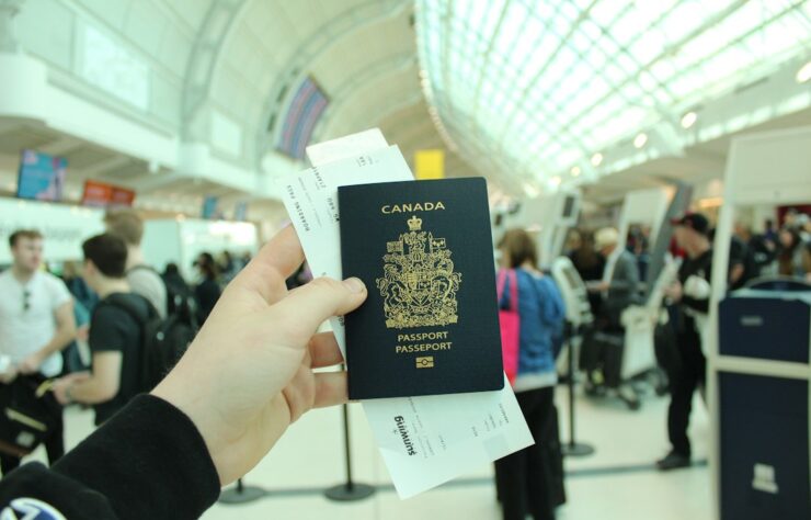 Canadian passport — photo by Kylie Anderson / Unsplash Canadian passport illustrating Express Entry permanent residence invitations