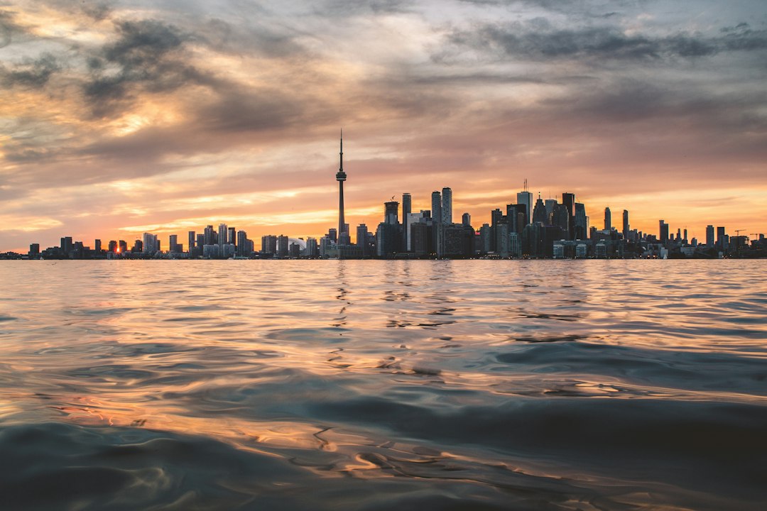 Toronto skyline viewed across Lake Ontario, illustrating Ontario immigration pathways